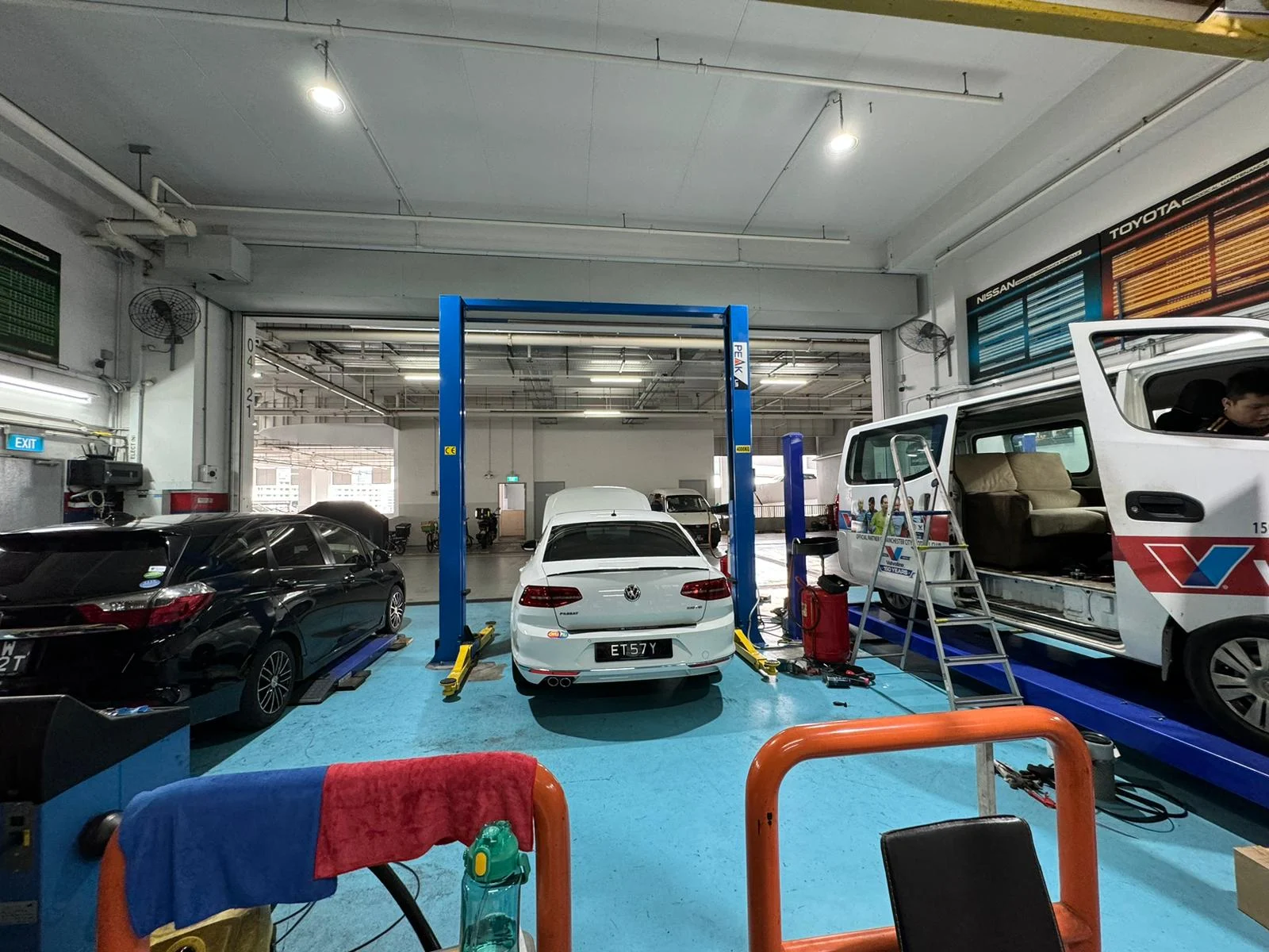 Inside the Autosaver workshop with vehicles and service lifts
