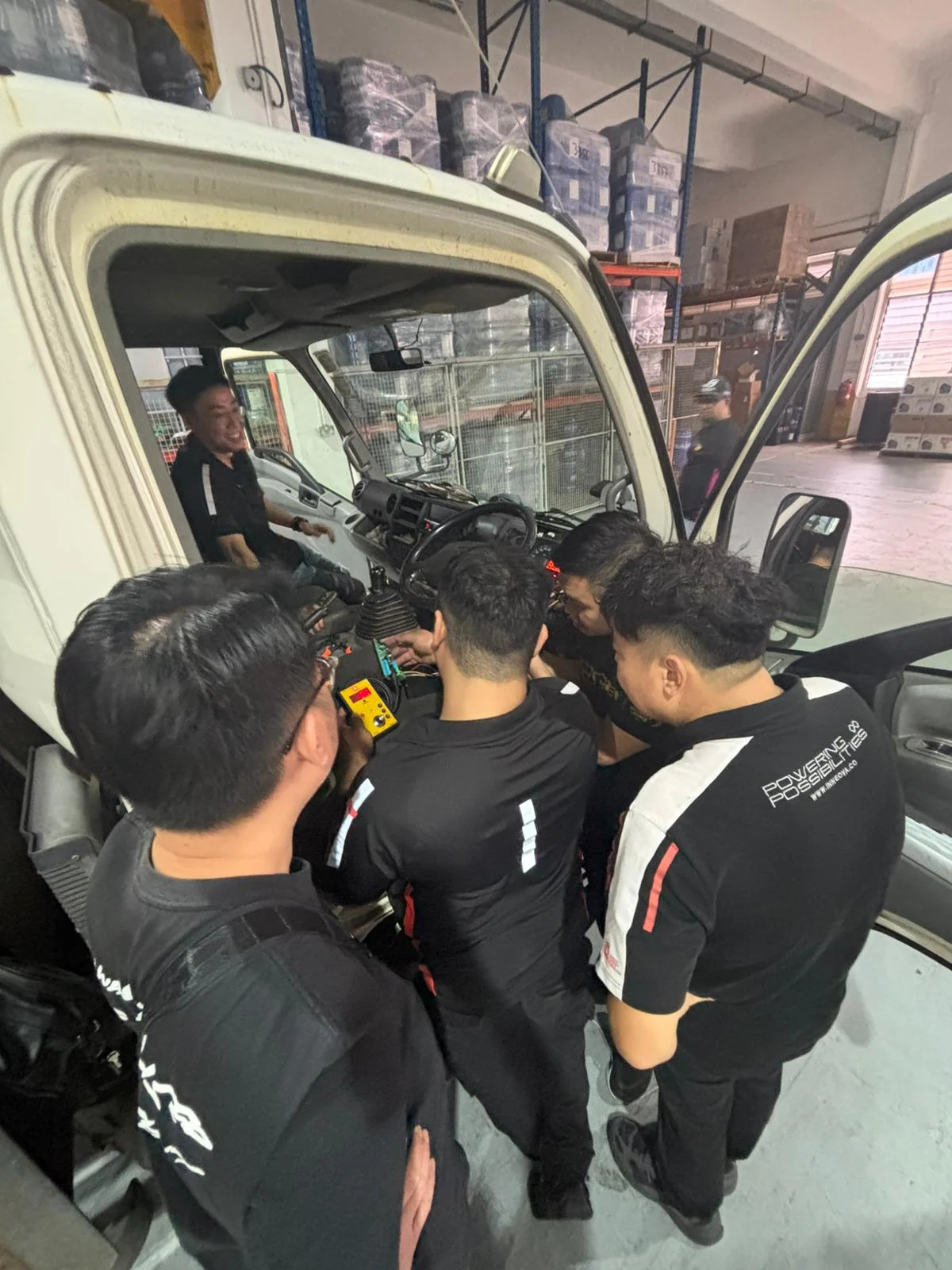 Team examining a vehicle